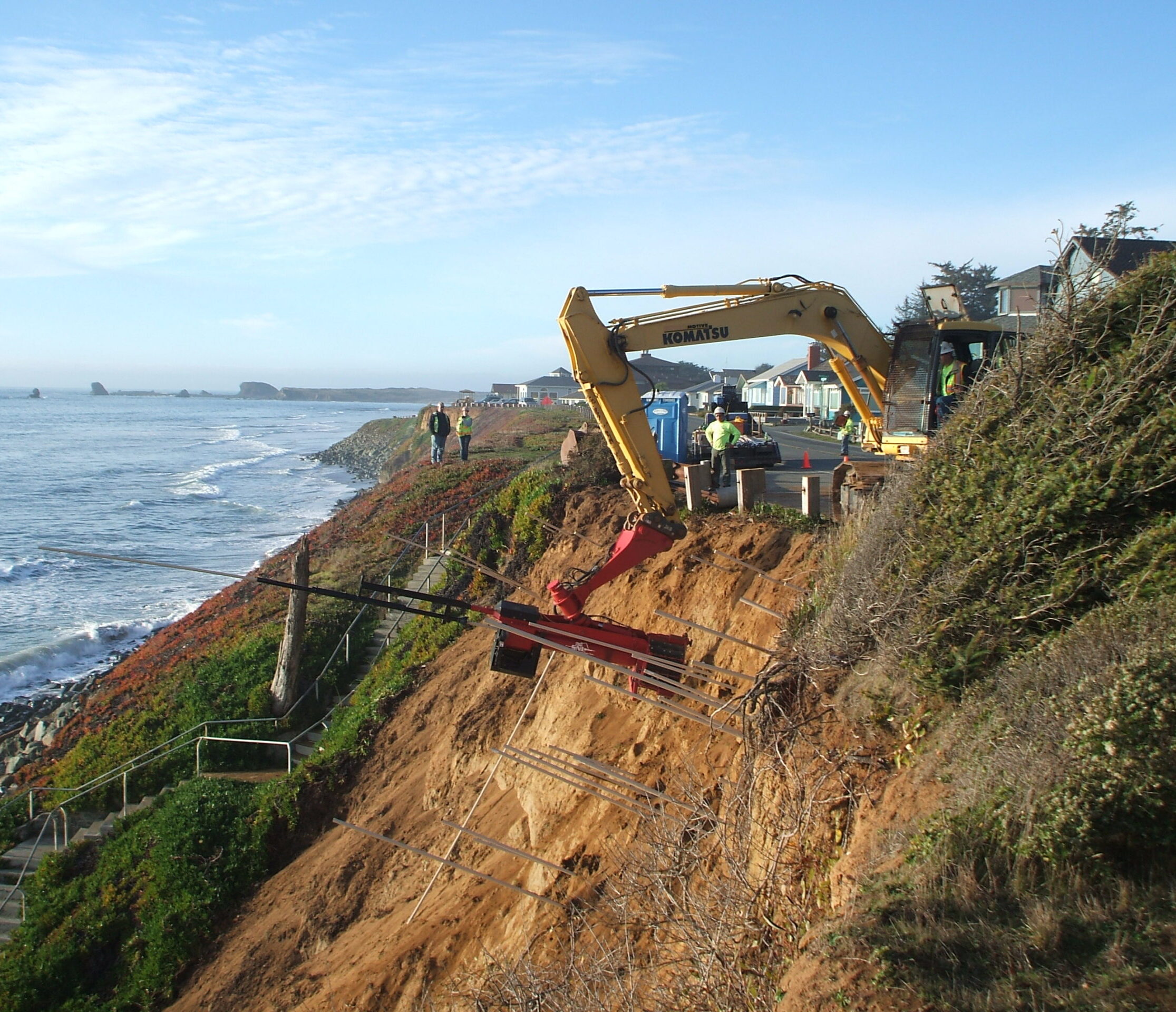 Excavator working on coastal bluff stabilization.