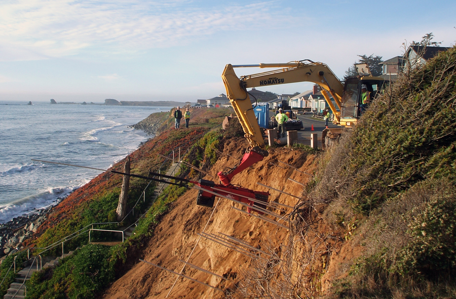 Soil nail launcher stabilizing a coastal bluff.