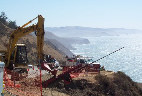 Soil nail launcher stabilizing a coastal highway slope.