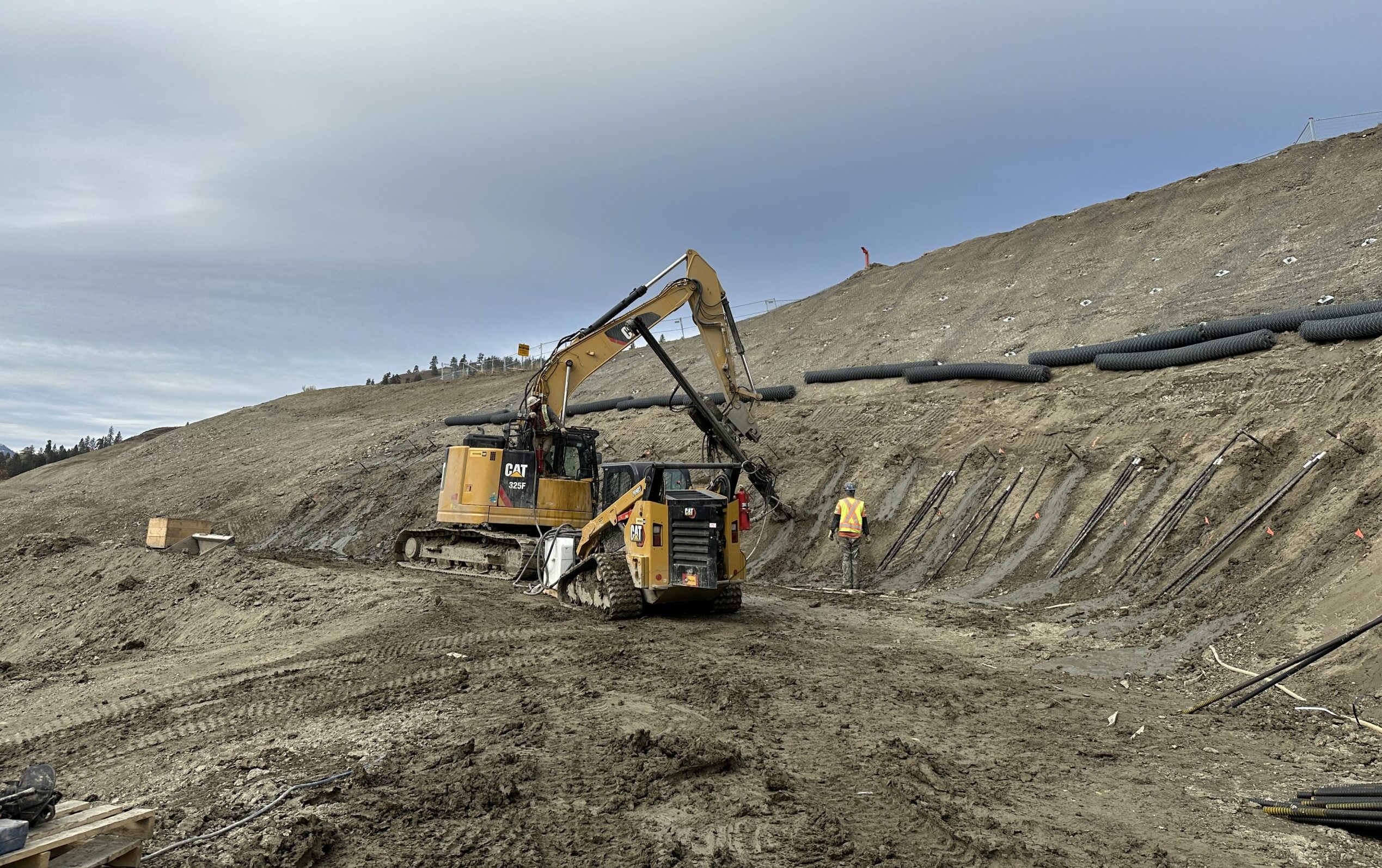 Two soil nail launchers on a hillside