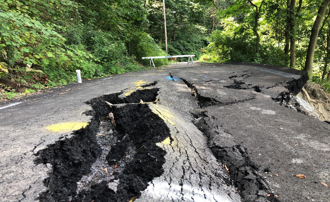 Roadway cracking and settlement.